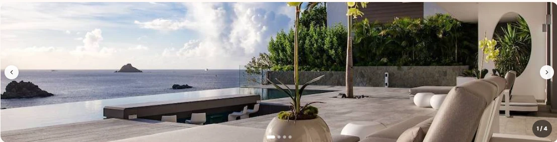 A wellness terrace with a pool and loungers looking out to sea.